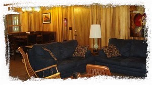 Open floor plan with comfy seating. Cherry rockers, pull-out sofa